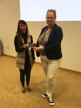 Natalie Courtney being presented with award